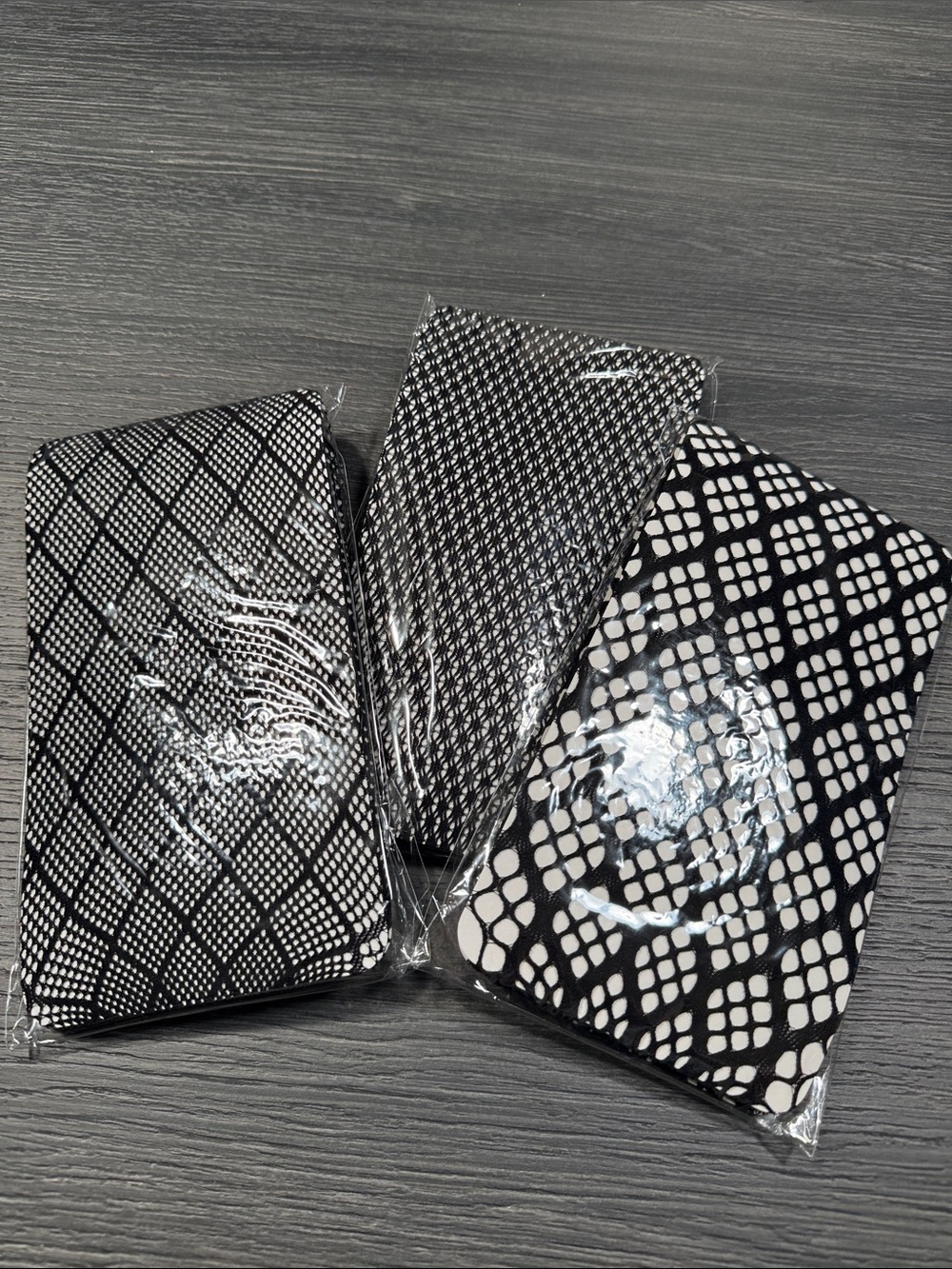 Three NWOT fishnet stockings. Size S/M.
